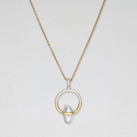 Gold and silver pendant with pearl on a gold chain