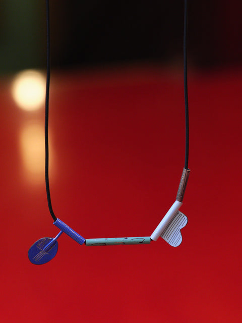 Necklace with a unique design on a red background